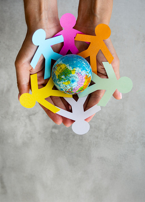 top-view-origami-chain-people-with-globe.jpg